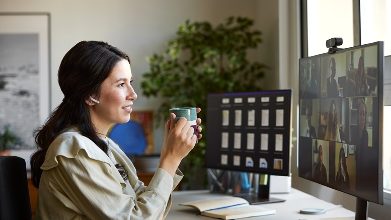 Lady with coffee viewing computer